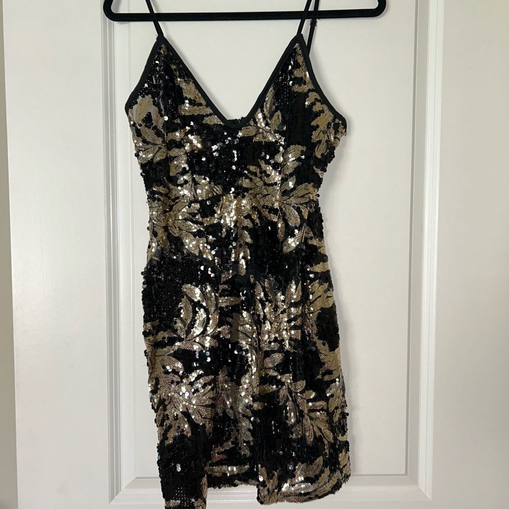 Ultra sexy semi-sheer sequined party dress.  Size M